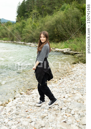 Modern Stylish Teenage Girl Outdoors Near the River. 130741486