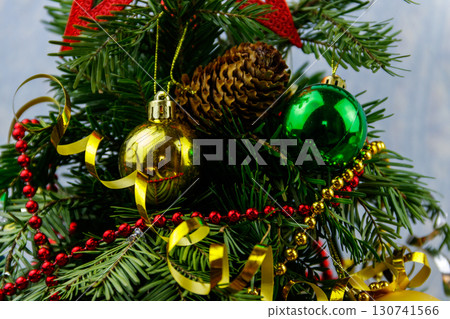 Beautiful Christmas decorations hanging on Christmas tree 130741566