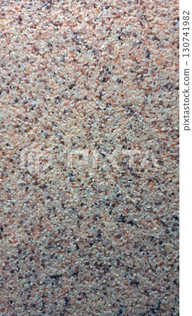 Close-up of speckled granite texture with natural earth tones Close-up of speckled granite texture with natural earth tones 130741982