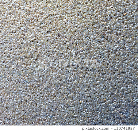 Close-up textured surface of small pebbles on a beach Close-up textured surface of small pebbles on a beach 130741987