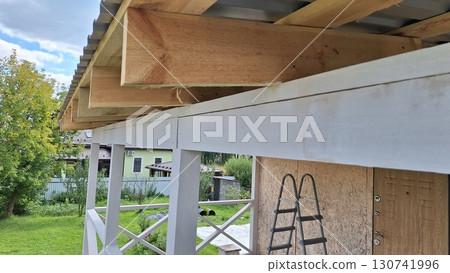 Home construction wooden roof beams outdoor building ladder structure Home construction wooden roof beams outdoor building ladder structure 130741996