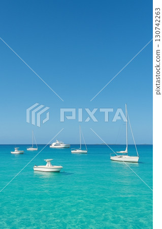 Boats and yachts floating on the blue sea/Symbol of summer and travel 130742263