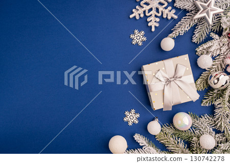 Christmas Border with White Ornaments and Frosted Pine Branches 130742278
