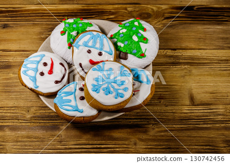 Christmas gingerbread cookies on a wooden background 130742456