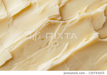 Close up shot highlighting the creamy, smooth texture of brie cheese, creating an appetizing visual 130743835