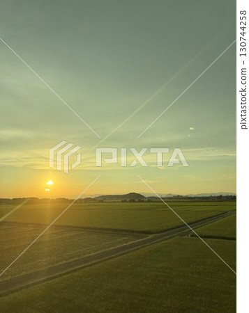 Sunset over the countryside: Scenery from the Shinkansen window 130744258