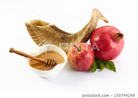 Rosh Hashanah Symbols. A shofar, apple, and pomegranate symbolize Rosh Hashanah 130744299