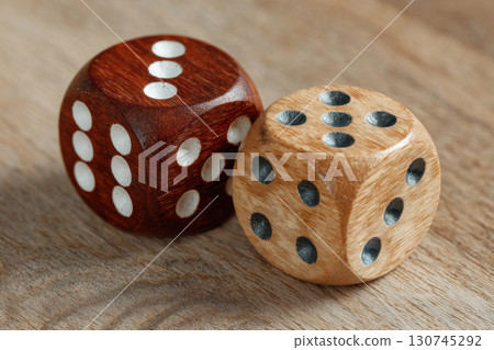Two dice on wooden surface Two dice on wooden surface 130745292