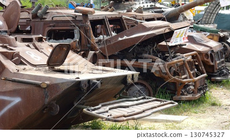 Rusty and burned-out armored vehicles on ukrainian territory. Exhibition of destroyed military equipment of the russian army. War between Ukraine and russia. Close up Slow motion 130745327