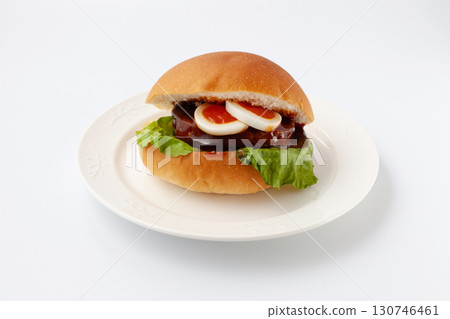 Teriyaki burger on a plate isolated on white background 130746461
