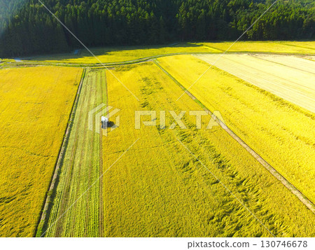Aerial view of rice harvesting in Assabe Town, Hokkaido in early autumn 130746678