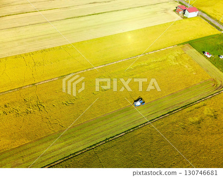Aerial view of rice harvesting in Assabe Town, Hokkaido in early autumn 130746681