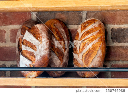 Baked loafs at the show shelf of a bakery 130746986
