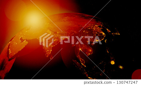 The Earth glows intensely with orange and red hues, showcasing illuminated cities and landscapes from a space perspective during nighttime, highlighting the planet's heat and activity. 130747247