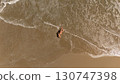 Pregnant Woman Relaxing by the Ocean Aerial Beach Photography 130747398