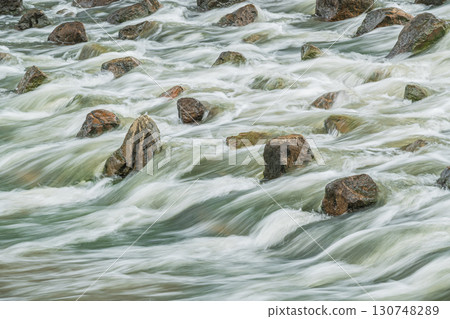 The Amano River turns muddy after the rain in Hirakata City, Osaka Prefecture 130748289