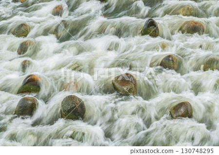 The Amano River turns muddy after the rain in Hirakata City, Osaka Prefecture 130748295