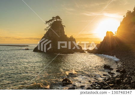 "Iwate Prefecture" Kosode Coast Tsurigane Cave, Kuji City, shining golden in the morning sun 130748347