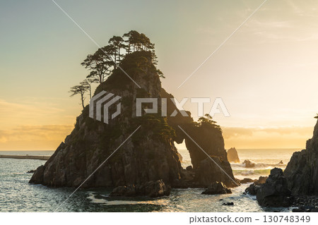 "Iwate Prefecture" Kosode Coast Tsurigane Cave, Kuji City, shining golden in the morning sun 130748349
