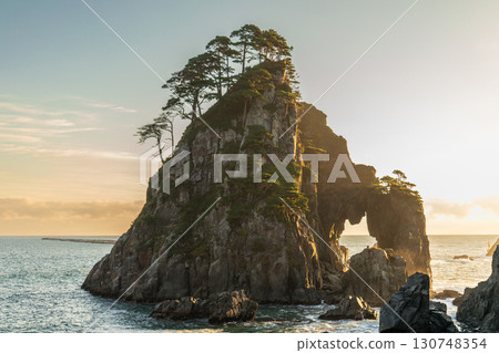"Iwate Prefecture" Kosode Coast Tsurigane Cave, Kuji City, shining golden in the morning sun 130748354