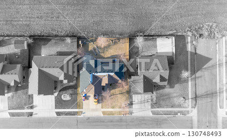 aerial view above a re-roofing overlay project at a residential house with black and white surroundings aerial view above a re-roofing overlay project at a residential house with black and white surroundings 130748493
