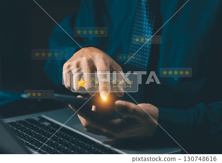 Poor rating concept. Negative feedback. Businessman Choosing 1 star rating review in the survey via a smartphone. Customer satisfaction research. Bad user experience. Customer experience dissatisfied. 130748616