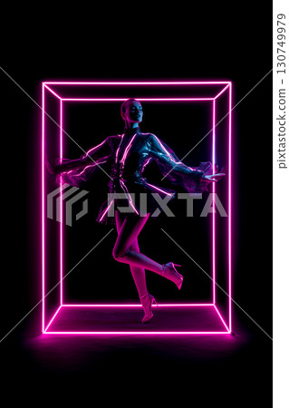 A woman in a neon pink dress is standing in a box 130749979