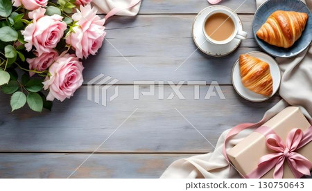 A lovely Valentine's Day display featuring croissants, roses, and a gift box, perfect for honoring love and gratitude 130750643