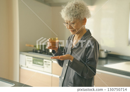 Elderly people who take medication upon waking Elderly people who take medication upon waking 130750714
