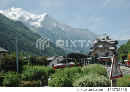 The Alps, a midsummer trip to Switzerland - the perpetually snow-capped mountain ranges of the European Alps towering behind the mountain railway The Alps, a midsummer trip to Switzerland - the perpetually snow-capped mountain ranges of the European Alps towering behind the mountain railway 130752536