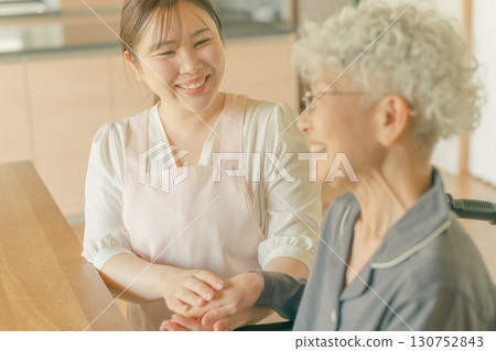 Elderly woman and care staff Elderly woman and care staff 130752843