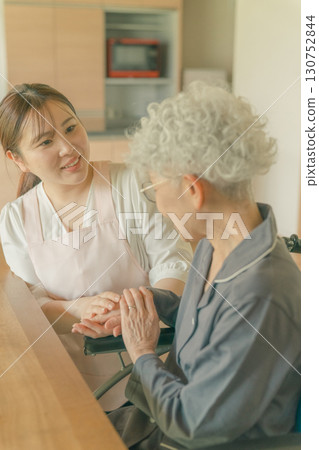 Elderly woman and care staff Elderly woman and care staff 130752844