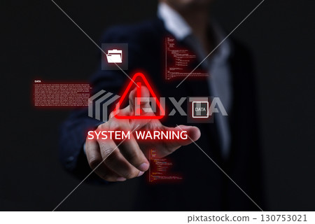 Businessman pressing virtual screen with red system warning alert, cybersecurity risk, data breach, and malware attack concept for IT security and digital protection background. Businessman pressing virtual screen with red system warning alert, cybersecurity risk, data breach, and malware attack concept for IT security and digital protection background. 130753021