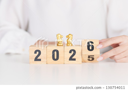 Happy New Year 2025 change to 2026 year block with horse chess. Year of the Horse, animals of the Chinese zodiac, horoscope, success and good fortune 130754011