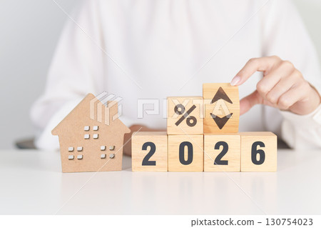 2026 New Year with percentage change to UP and Down arrow with Home model. Real estate Mortgage, Refinance, House loan and debt, Interest rate, Insurance, Financial and Property Tax 130754023