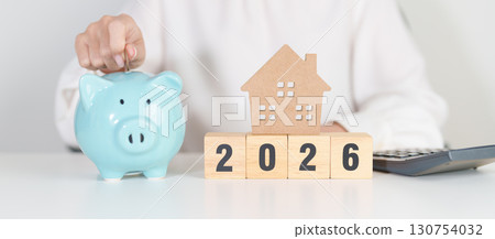 Happy New Year 2026 with house model and Coins stack. real estate, Home loan, tax, investment, mortgage, financial, savings and New Year Resolution concepts Happy New Year 2026 with house model and Coins stack. real estate, Home loan, tax, investment, mortgage, financial, savings and New Year Resolution concepts 130754032