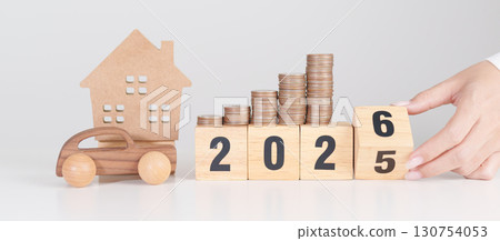 2025 end year to Happy New Year 2026 with car and Home model with coin stack. Car loan, Interest rate, real estate, house, Insurance, Financial, Repair, Tax, mortgage and Maintenance 130754053