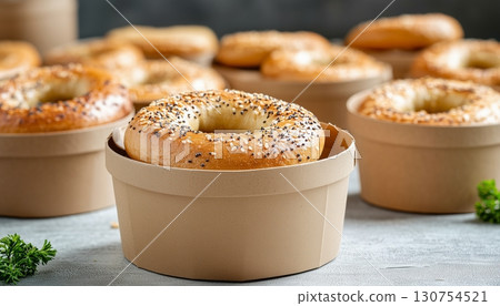 Breakfast bagel on brown paper craft take away disposable bowl in ceramic white table Breakfast bagel on brown paper craft take away disposable bowl in ceramic white table 130754521