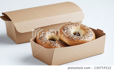 Breakfast bagel on brown paper craft take away disposable bowl in ceramic white table 130754522