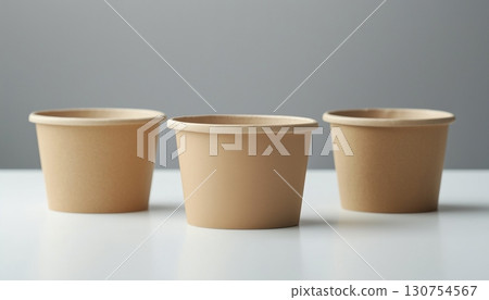 Disposable brown paper bowl cup take away for snack or dessert in white room 130754567