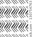 repeating black and white geometric arrow pattern with zigzag lines on white background 130754763