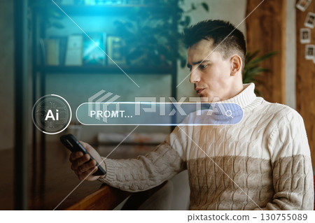 Young man engaging with smartphone in a cozy indoor setting while exploring digital content in the late afternoon Young man engaging with smartphone in a cozy indoor setting while exploring digital content in the late afternoon 130755089