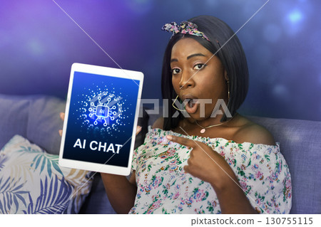 Engaging woman showcases AI chat technology with excitement in a cozy living room setting during daytime 130755115