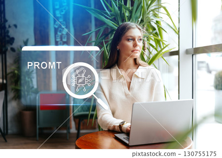 Professional woman using laptop in a cozy cafe while exploring AI technology and digital innovation in her work 130755175