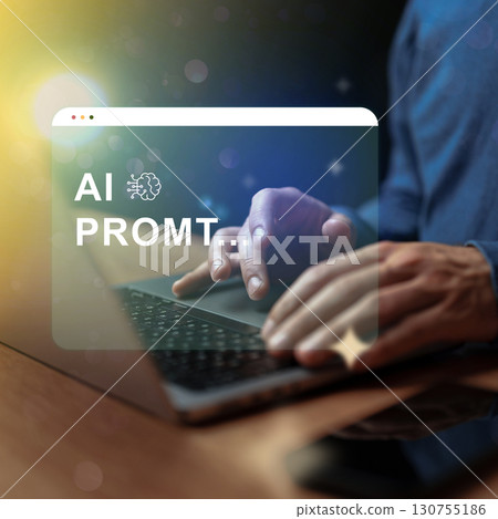 Creative professional working on AI prompt generation at night with a laptop and warm light in the background Creative professional working on AI prompt generation at night with a laptop and warm light in the background 130755186