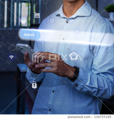 Person using smartphone in modern workspace while engaging with technology and online search functions 130755195