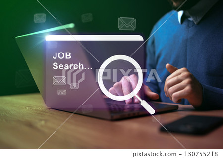 Job seeker engaged in online search for employment opportunities on a laptop Job seeker engaged in online search for employment opportunities on a laptop 130755218