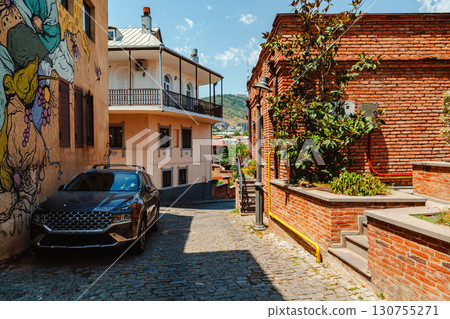 Exploring the cobblestone streets of Tbilisi's scenic neighborhood during a sunny afternoon Exploring the cobblestone streets of Tbilisi's scenic neighborhood during a sunny afternoon 130755271