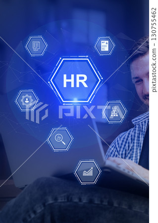 Man engaged in human resources activities with digital interface elements in a modern office setting 130755462