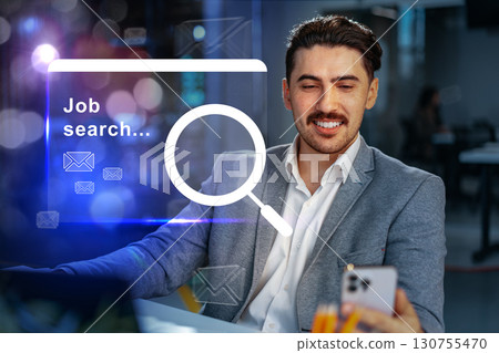 Professional man engaged in job search while using a smartphone in a modern office environment during the afternoon Professional man engaged in job search while using a smartphone in a modern office environment during the afternoon 130755470